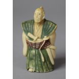 An Early 20th Century Japanese Carved Netsuke in the Form of a Scholar with Scroll in Hand Decorated