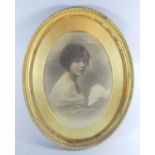 A Gilt Oval Framed Monochromed Photograph of a Girl, 67cm High