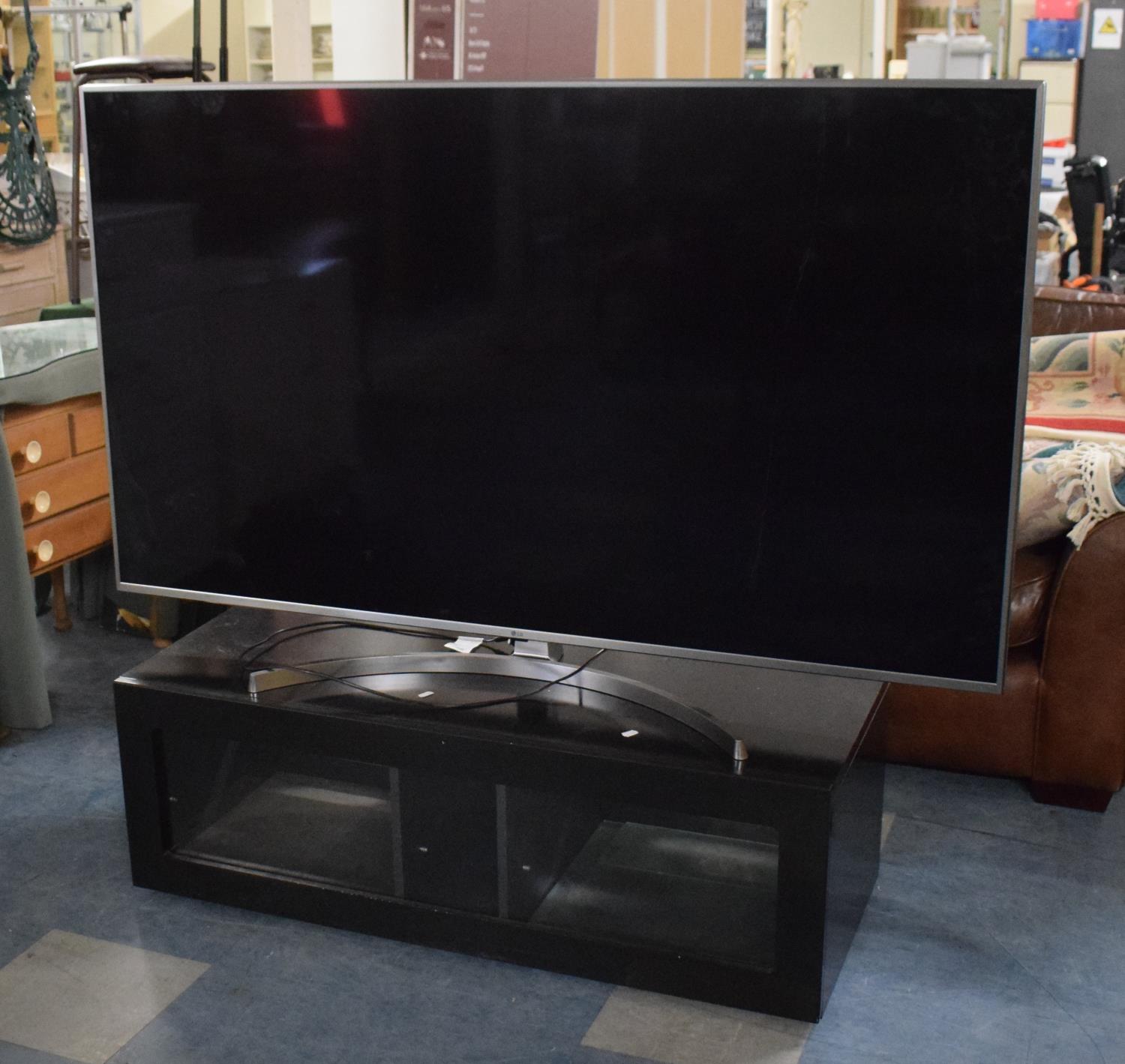 A 2019 LG UHD TV AI ThinQ Television, 65" with Remote and Box and Complete with Stand