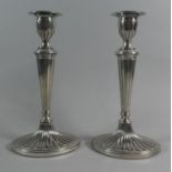 A Pair of Regency Style Silver Plated Candlesticks with Reeded Supports, 25cm high
