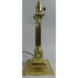 An Edwardian Brass Table Lamp in the Form of a Corinthian Column on Iron Weighted Stepped Base, 36cm