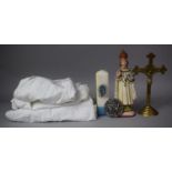 A Brass Crucifix, Plaster Altar Figure, Religious Candle and Christening Gowns etc