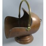 A Copper and Brass Helmet Shaped Coal Scuttle, 40cm Long