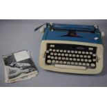 A Vintage Imperial Safari Portable Manual Typewriter with Instructions