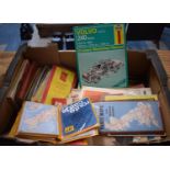 A Box Containing Various Vintage Road Maps, Haynes Volvo 240 Workshop Manual etc