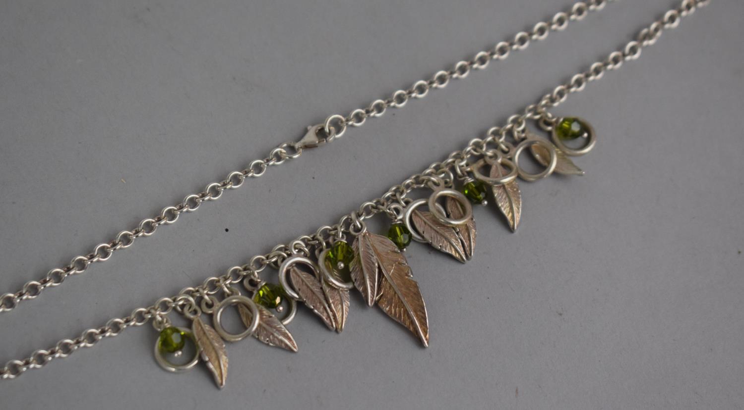 A Silver Necklace with Feather and Green Bead Decoration - Image 2 of 3