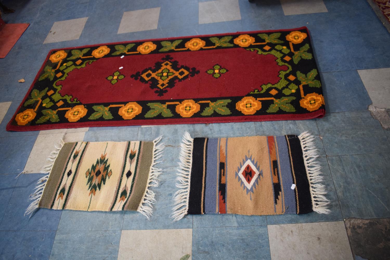 A Woven Woollen Rug and Two Small South American Rugs