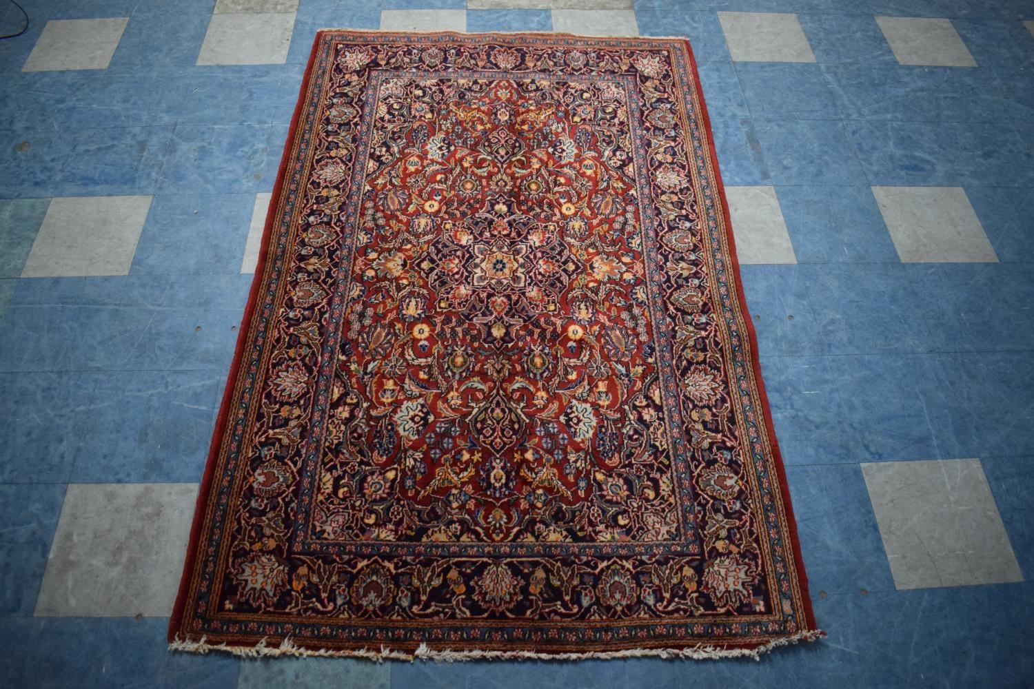 An Antique Persian Hand-Made Keshan Rug, 205 x 130cms