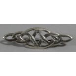 A Silver Brooch in the Form of a Knot