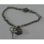 A Silver Bracelet with Three Charms