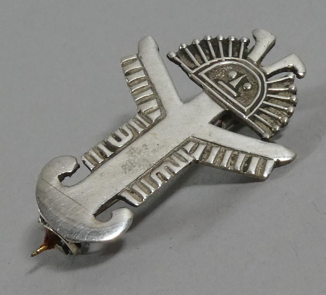 A Small Silver Novelty Brooch in the Form of Aztec Figure