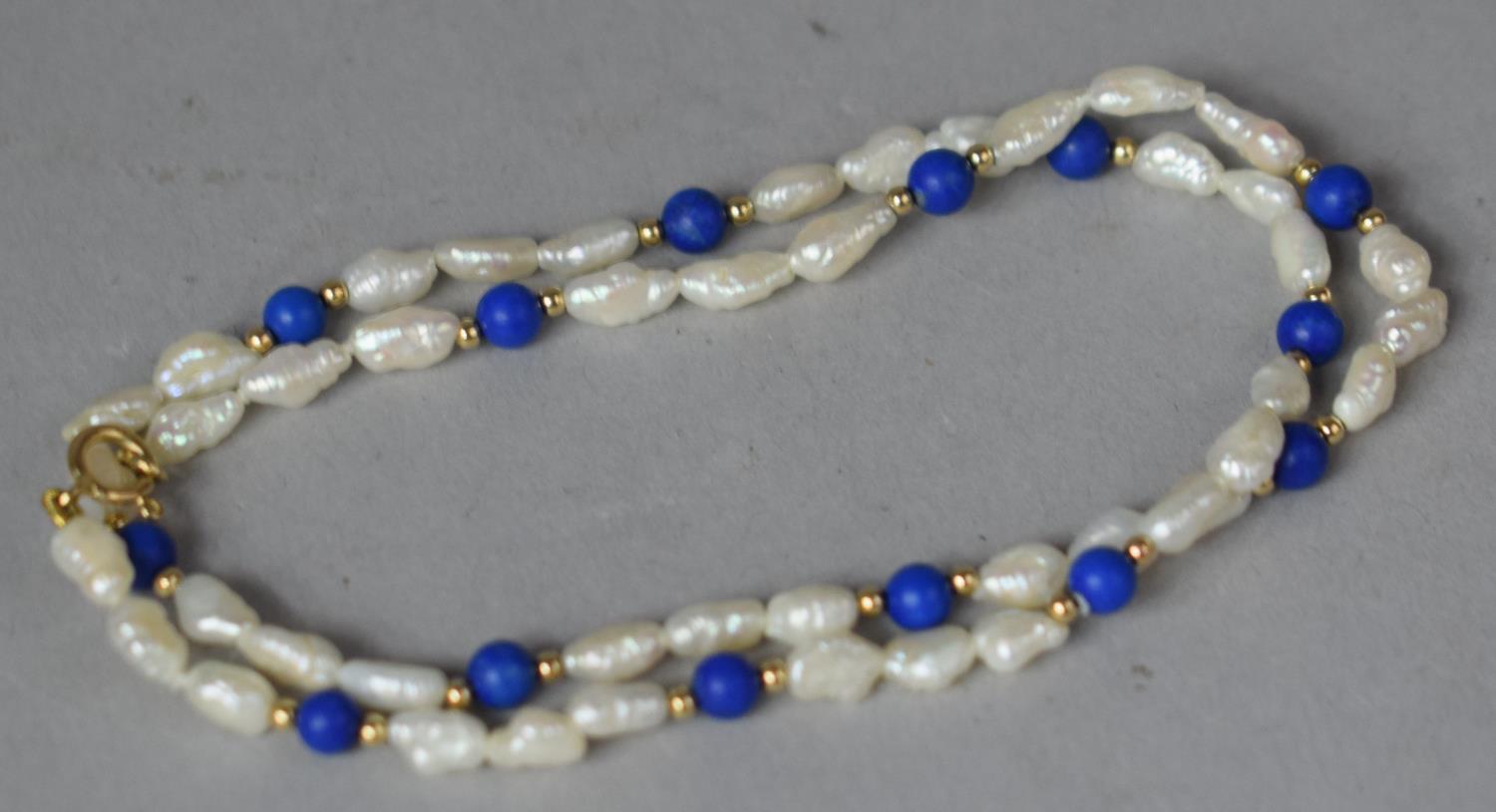 A Fresh Water Pearl and Lapis Lazuli Bead Necklace with 9ct Gold Clasp