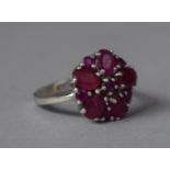 A White Metal and Ruby Cluster Ring, Stamped but Illegible