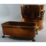 A Small Rectangular Copper Planter with Brass Lion Mask Carrying Handles and Claw Feet Together with