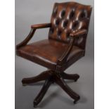 A Buttoned Leather Effect Swivel Office Armchair