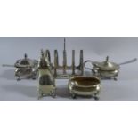 A Silver Four Slice Toast Rack Together with a Silver Plated Four Piece Cruet Set