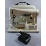 A Vintage Electric Sewing Machine with Power Cable and Foot Control