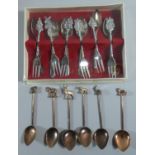 A Set of Six African Spoons with Wild Animal Terminals Together with a Set of Cake Forks and