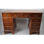 A Reproduction Mahogany Kneehole Writing Desk with Tooled Leather Writing Surface with Three Drawers