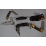 A Collection of Four Penknives and a Swiss Army Type Multitool Knife