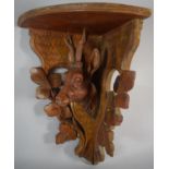 A Carved Black Forest Corner Wall Shelf mounted with Stag, Antler AF, 36cm High