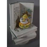 A Schmid Music Box in the form of a Stack of Beatrix Potter Books and Jeremy Fisher Seated on top