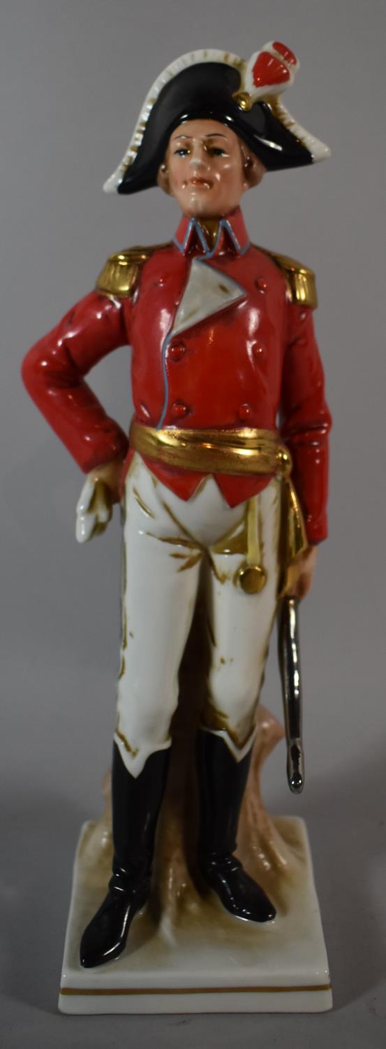 A Spanish Porcelain Figure of a Soldier, 25.5cm high