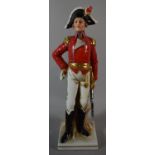 A Spanish Porcelain Figure of a Soldier, 25.5cm high