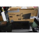 A Wall Mounting Humax 17" Flat Screen TV with Remote