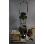 A Vintage Hurricane Lamp by Aladdin Together with Various Funnels, Oil Cans and Accessories