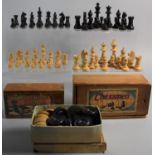 Two Boxwood Chess Sets, The Smaller Missing One Pawn Together with a Box Containing Draughts Pieces