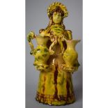 A 20th Century Continental Terracotta Glazed Study of Winged Maiden with Bonnet Carrying Urns,