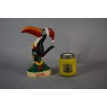 A Coleman's Mustard Inkwell and Royal Doulton Guinness Toucan, 14.5cm high
