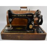 A Vintage Oak Cased Singer Sewing Machine