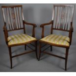 A Pair of Edwardian Inlaid Mahogany Side Arm Chairs