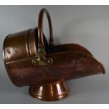 A Late Victorian Copper Helmet Shaped Coal Scuttle, 39cm Long