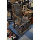 A Vintage Cane Backed and Seated Wheelchair, in Need of Some Attention
