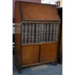 A Mid 20th Century Narrow Oak Hall Bureau Containing 12 Volumes Encyclopedia Britannica