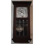 An Edwardian Mahogany Cased Wall Clock