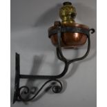 An Iron Bracket Containing Copper and Brass Oil Lamp