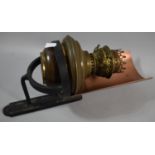 A Wall Hanging Iron Stand Containing Brass Oil Lamp