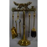A Brass Fire Companion Set with Red Setter Decoration, 50cm high