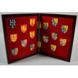 A Set of 15 Enamelled Coat of Arms Shields in Case