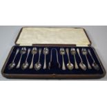 A Cased Set of 12 Silver Plated Teaspoons and Sugar Bow