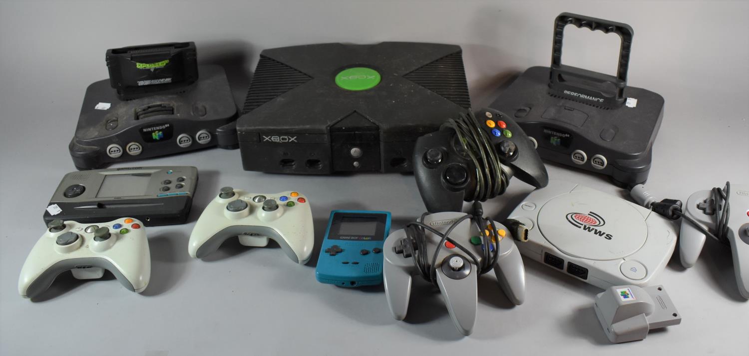 A Collection of Vintage Nintendo and Xbox Game Consoles and Controllers, not tested