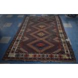 A Vintage Persian Patterned Woollen Rug, Some Losses and Wear, In Need of Cleaning and