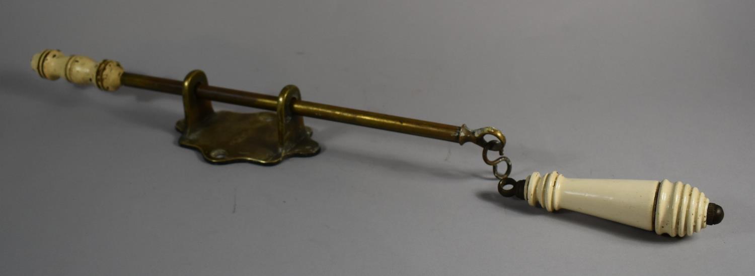 A Doulton and Co. Brass and Metal WC Flush Pull Bracket Together with a WC Handle Inscribed "Pull"