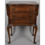 A Reproduction Serpentine Front Three Drawer Walnut Chest with Two Side Drop Leaves on Cabriole