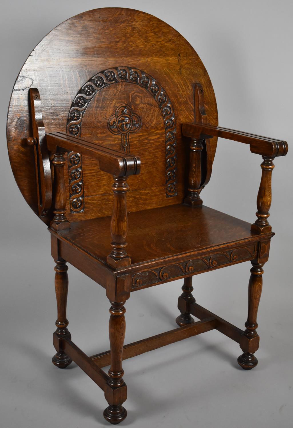 A Mid 20th Century Oak Circular Topped Monks Style Seat with Carved Decoration, 73cm Diameter