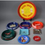 A Collection of Enamelled Metal Pub Advertising Ashtrays, Tray, Coca-Cola Poster